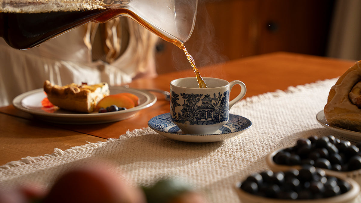 coffee and a slice of pie and some berries