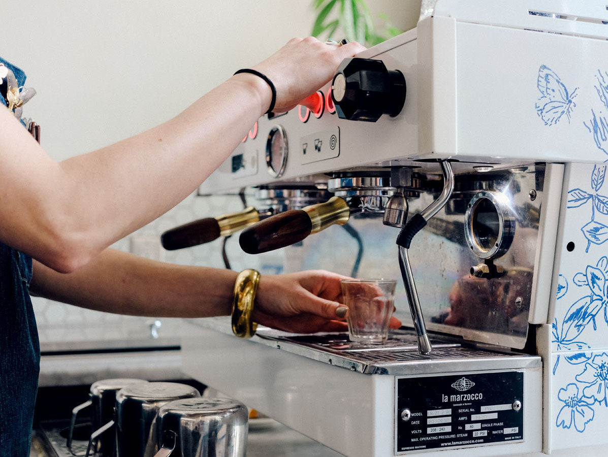 Barista pulling a shot of espresso