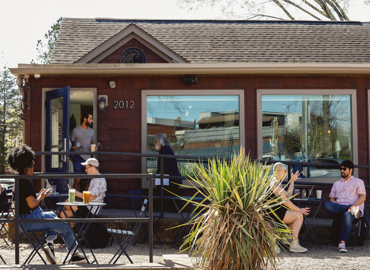 People enjoying coffee outside Under Current Coffee CLT